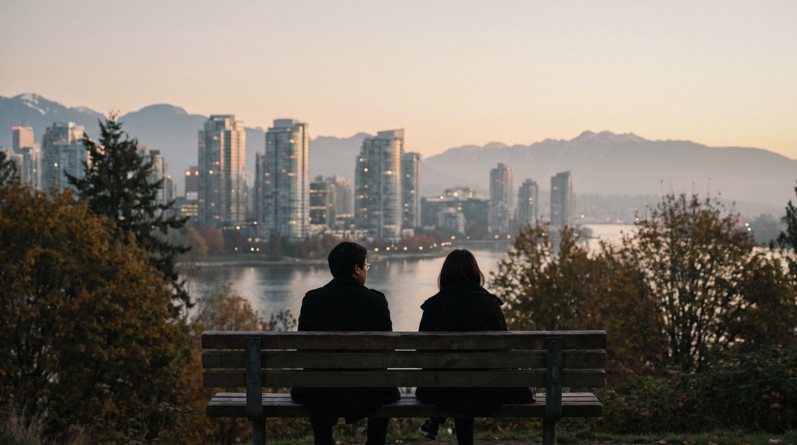 The city skyline with the harbour in front and snow-topped North Shore mountains behind on a clear afternoon, the view that answers whether Vancouver is worth visiting