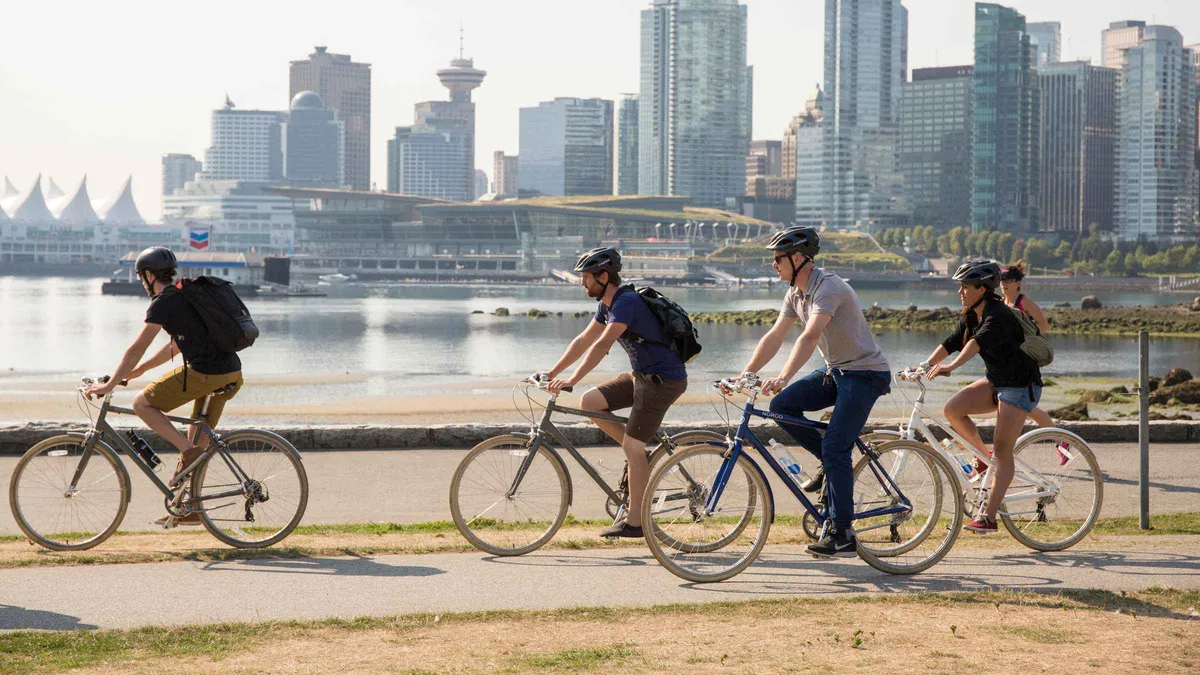 Cycling group outside Granville Island Public Market on a guided bike tour of Vancouver