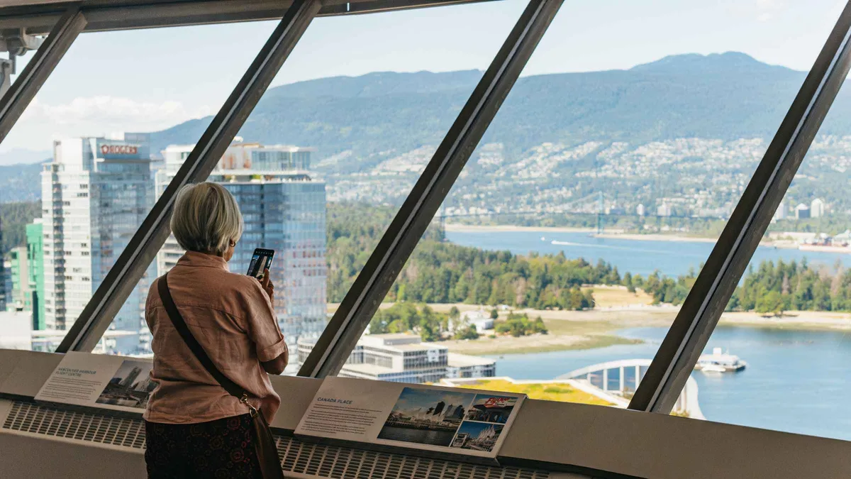 Glass elevator rising the Harbour Centre tower to the 360 degree observation deck, Vancouver Lookout entry ticket