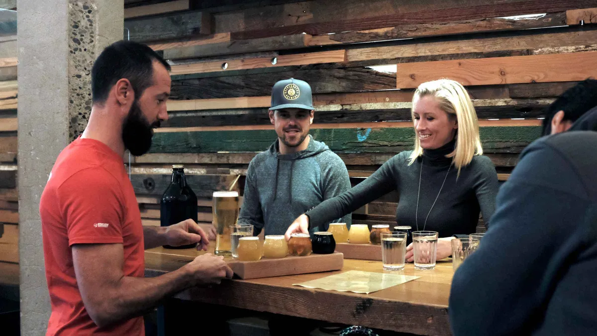 Tasting flight of craft beers at a Mount Pleasant brewery on a Vancouver craft beer culture and tasting tour