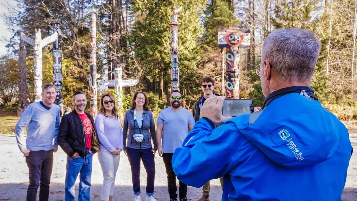 Narrated bus tour group at the Vancouver Lookout observation deck before crossing the Capilano bridge, city and Capilano Suspension Bridge ticket Vancouver