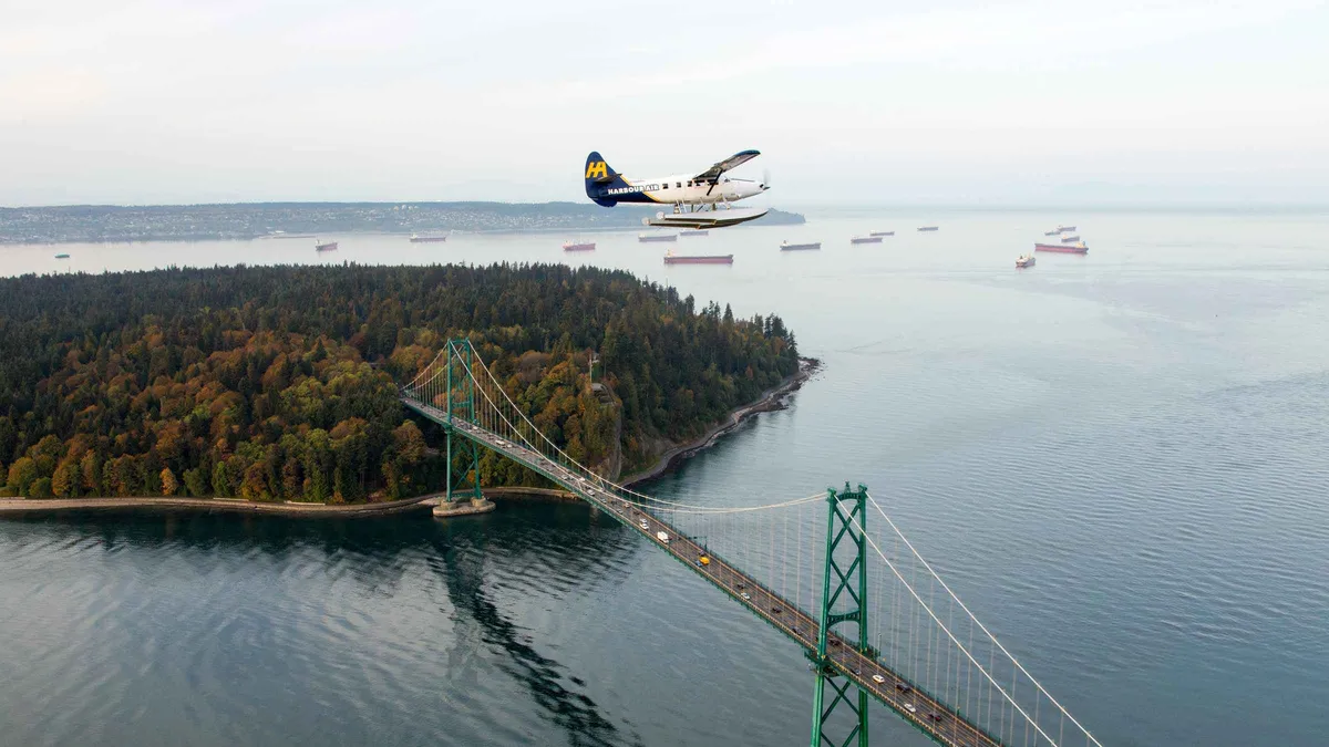 Seaplane over the North Shore with the Capilano canyon below, scenic panorama seaplane tour and Capilano Suspension Bridge Vancouver