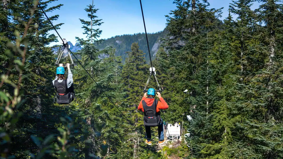 Small group boarding the Grouse Mountain gondola on a Grouse Mountain express tour with gondola ride from Vancouver