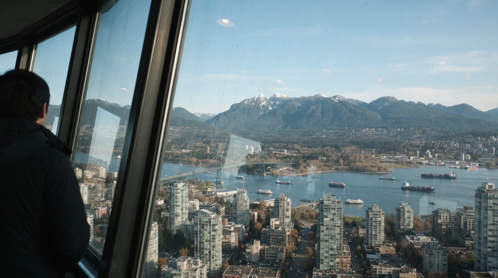 The saucer-shaped observation deck of the Vancouver Lookout on Harbour Centre above the downtown towers, Vancouver
